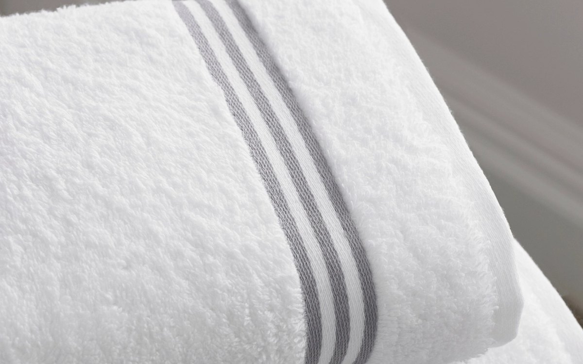 Folded linens produced by the Zleni laundry platform